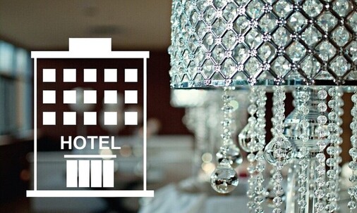 Close-up image of a chandelier, pictogram with hotel